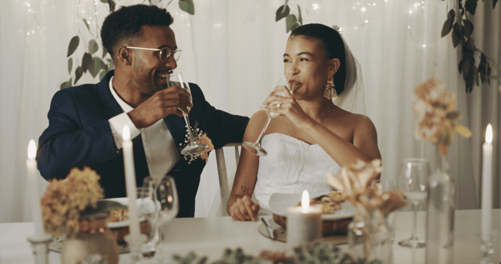 Bride and Groom drinking LoveLUVV Wedding Champagne